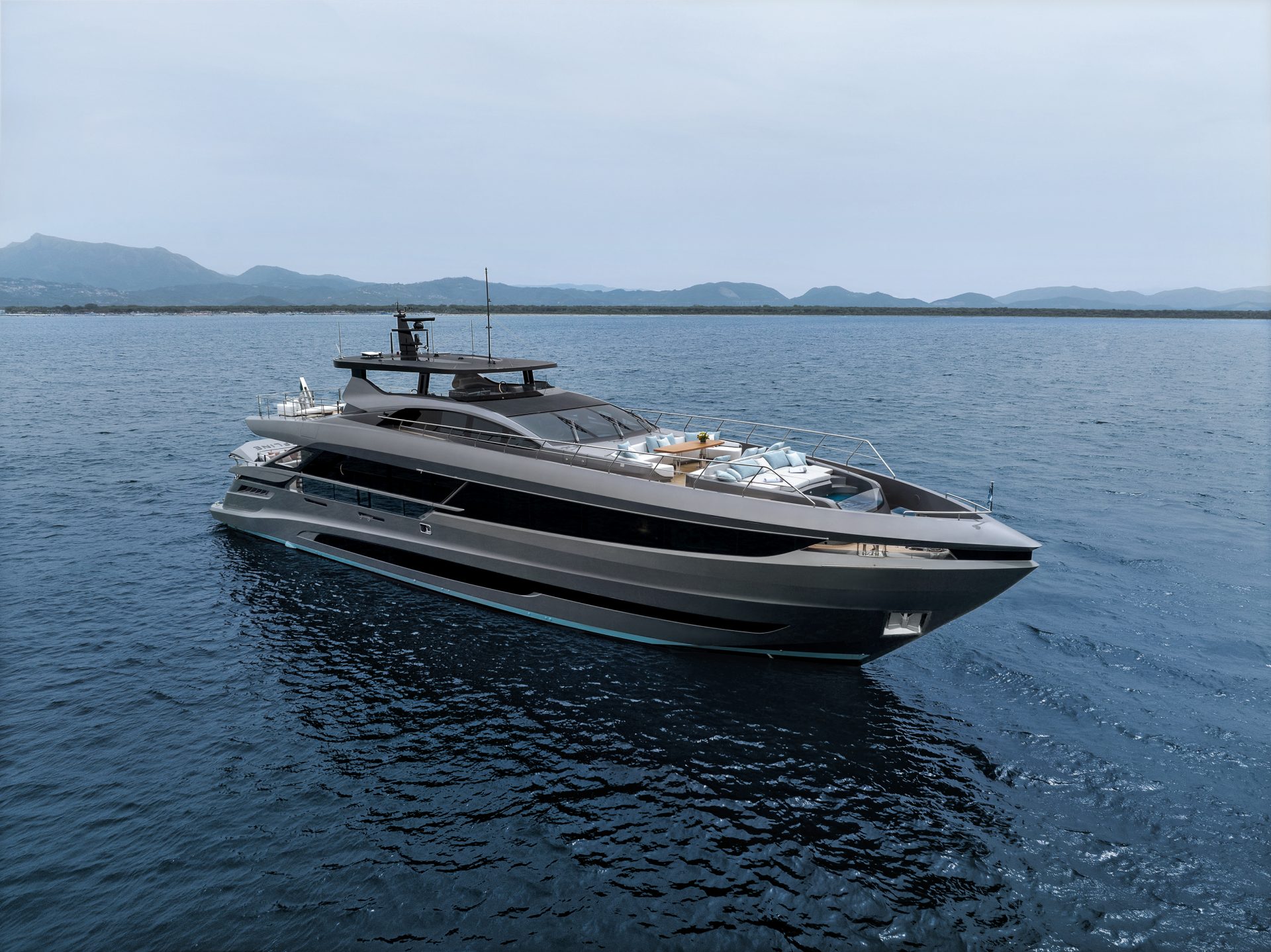 Mangusta yacht cruising on open sea with mountains