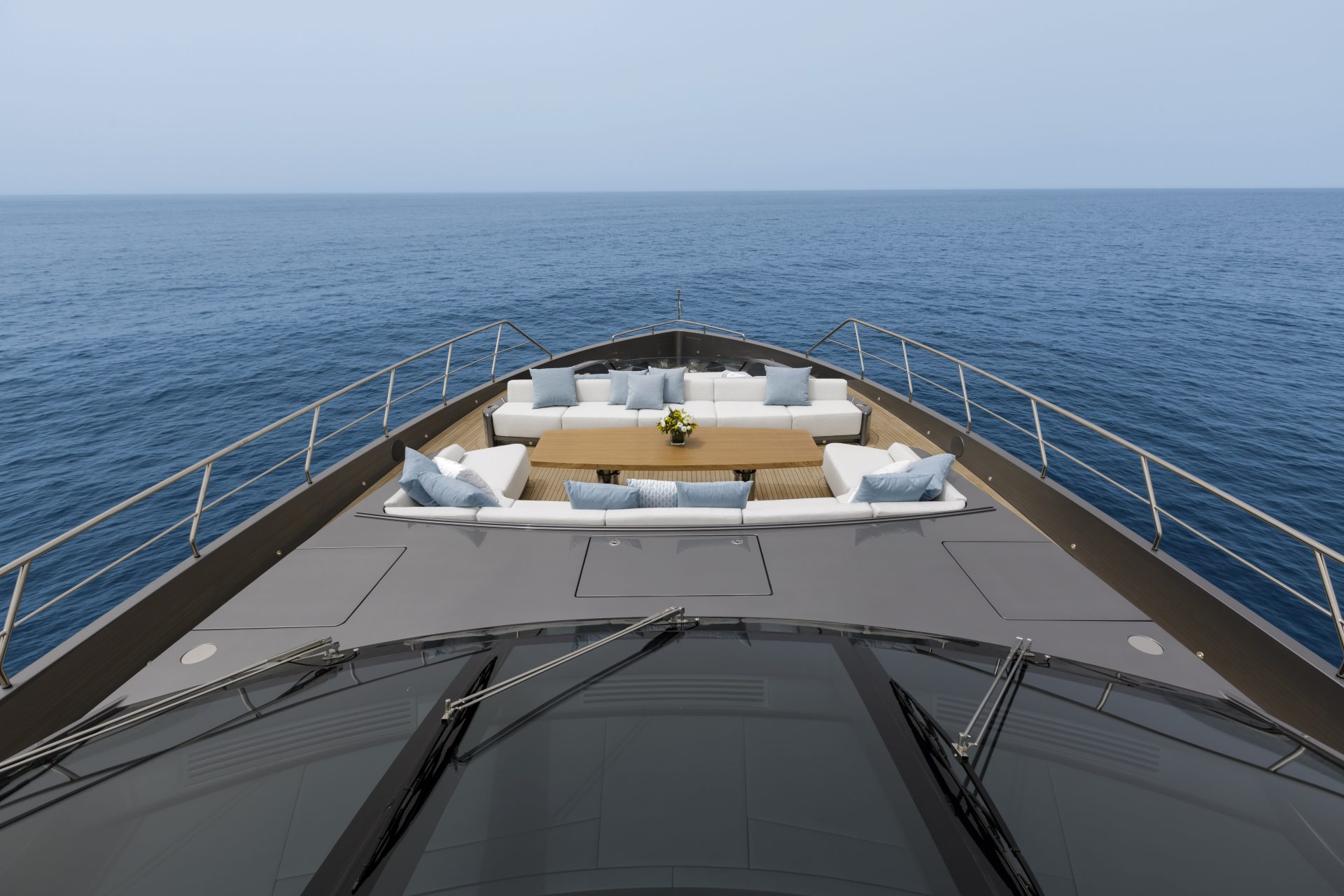 Luxurious deck on Mangusta yacht at sea.