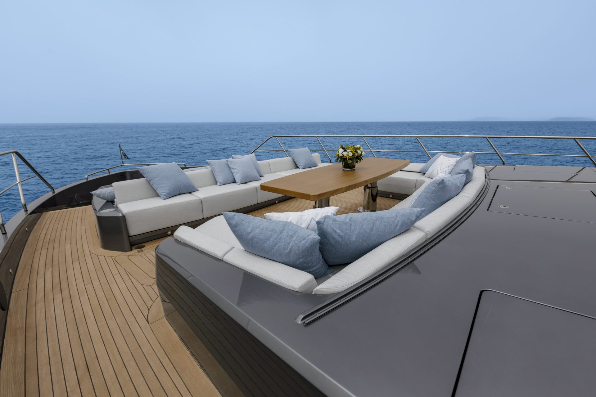 Luxury yacht deck with seating and ocean view