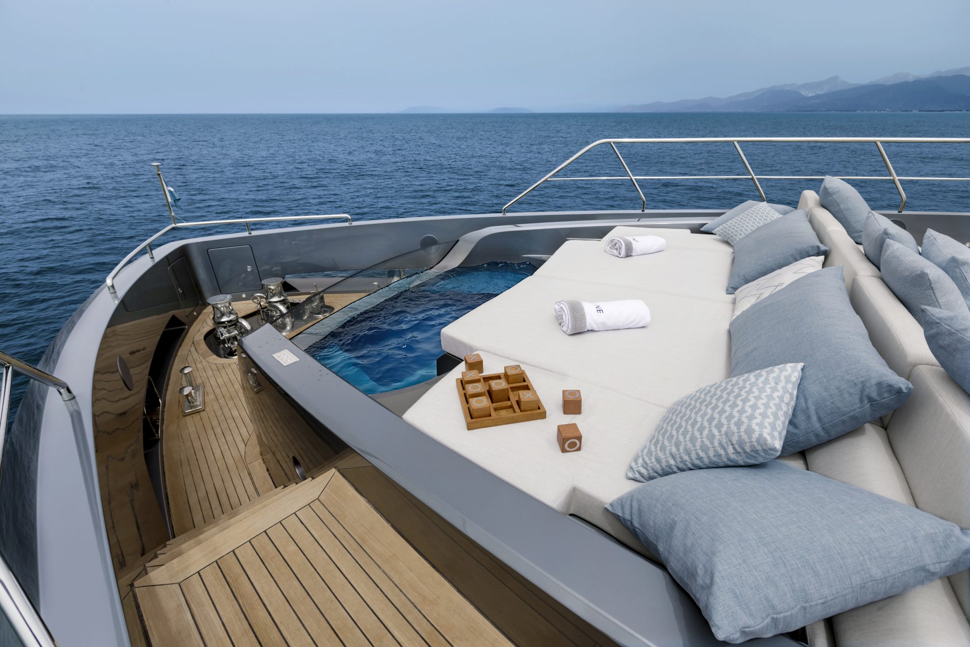 Luxurious deck lounge on Mangusta yacht with sea view