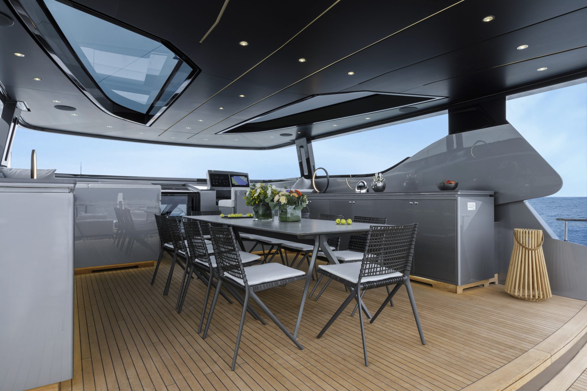 Spacious outdoor dining area on luxury yacht deck