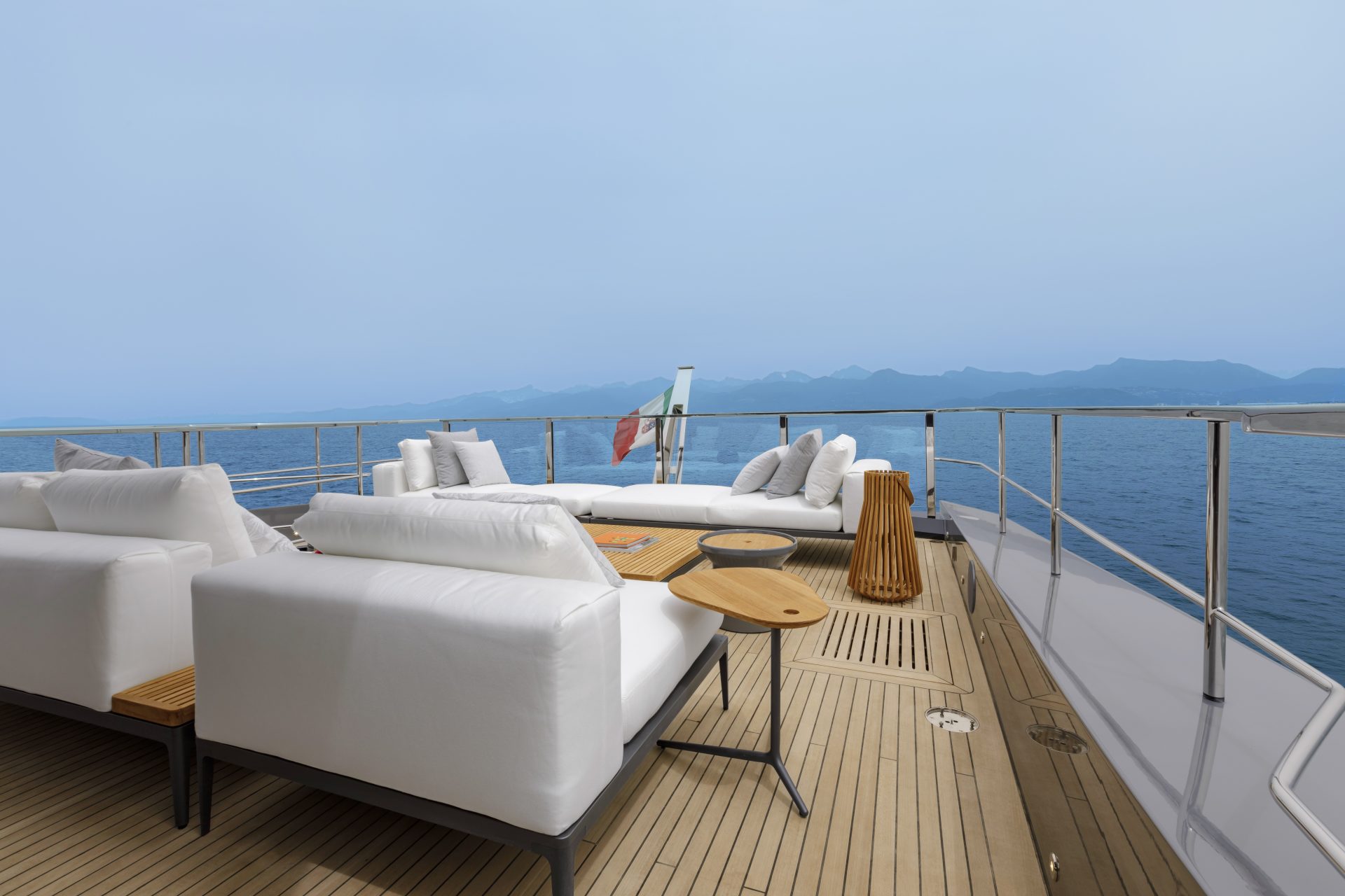 Luxury yacht deck with comfortable white sofas