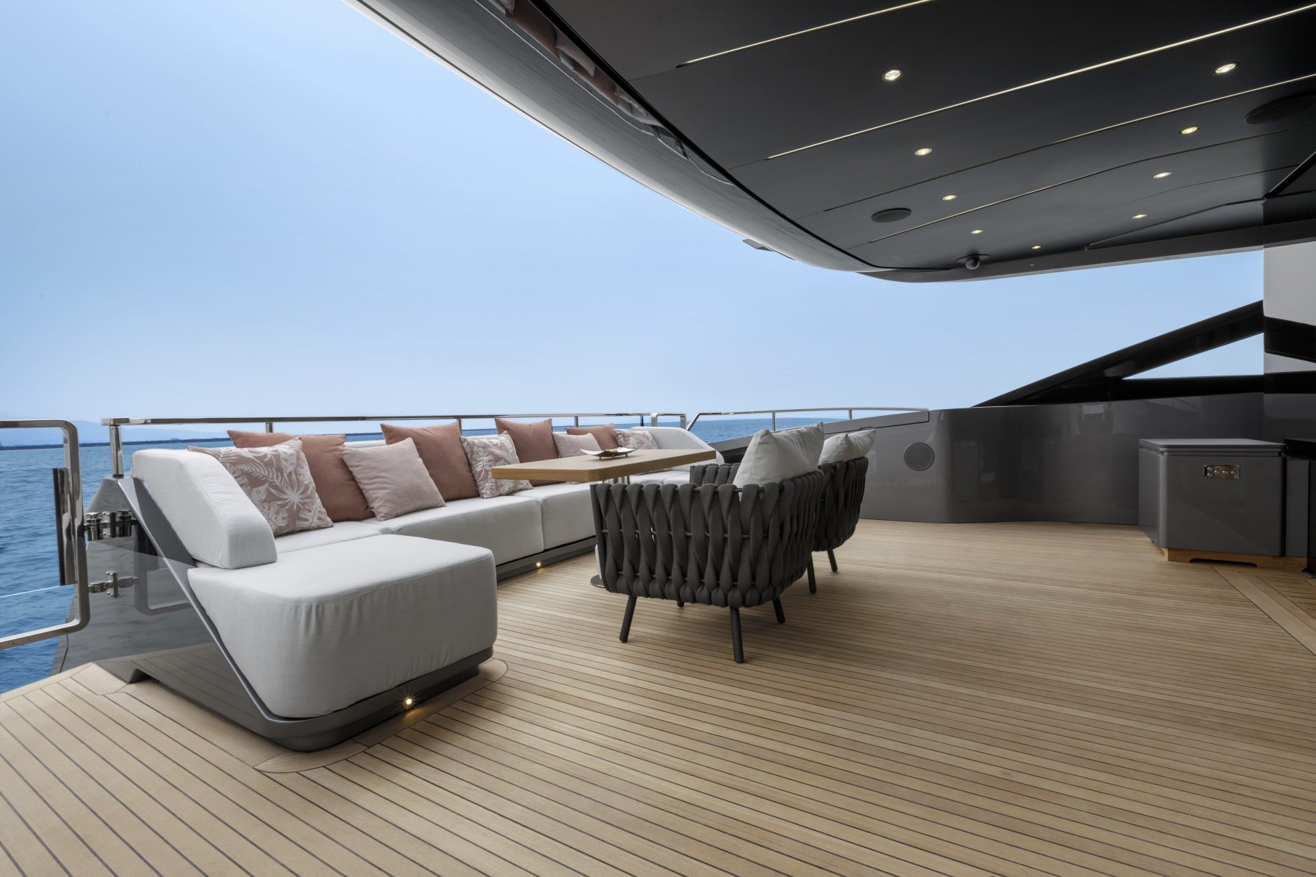 Luxury Mangusta yacht deck with elegant seating.