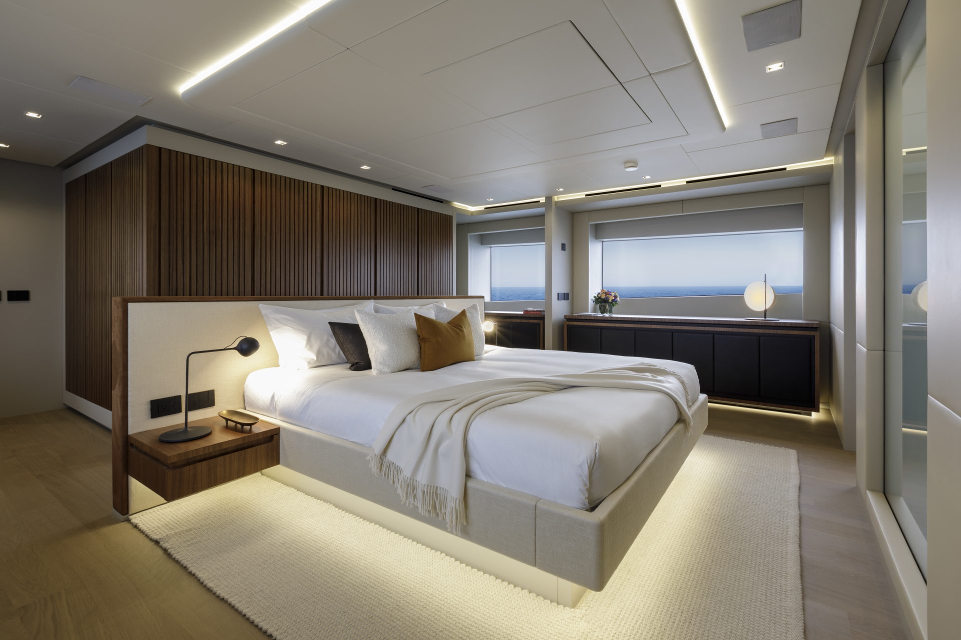 Luxury yacht bedroom with modern design elements.