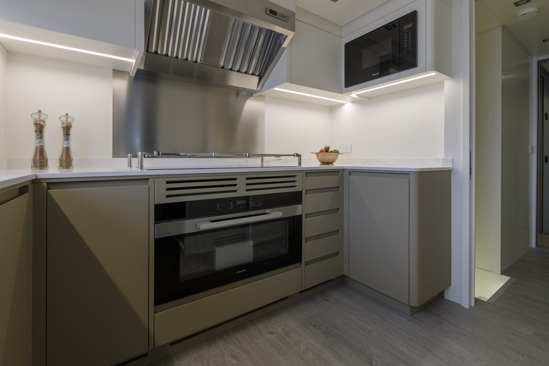 Modern yacht kitchen with stainless steel appliances