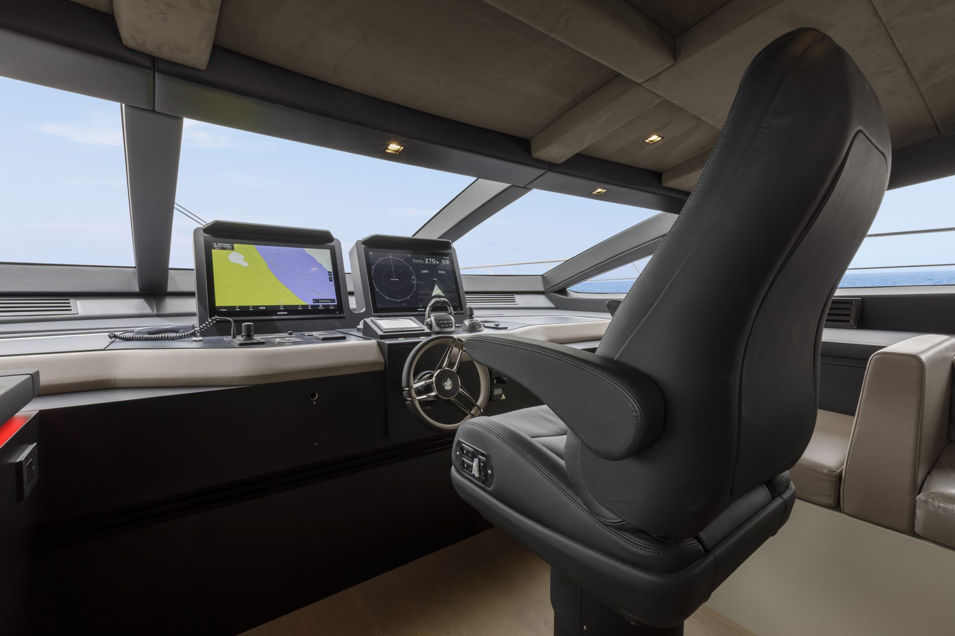 Luxurious yacht helm with navigation screens.