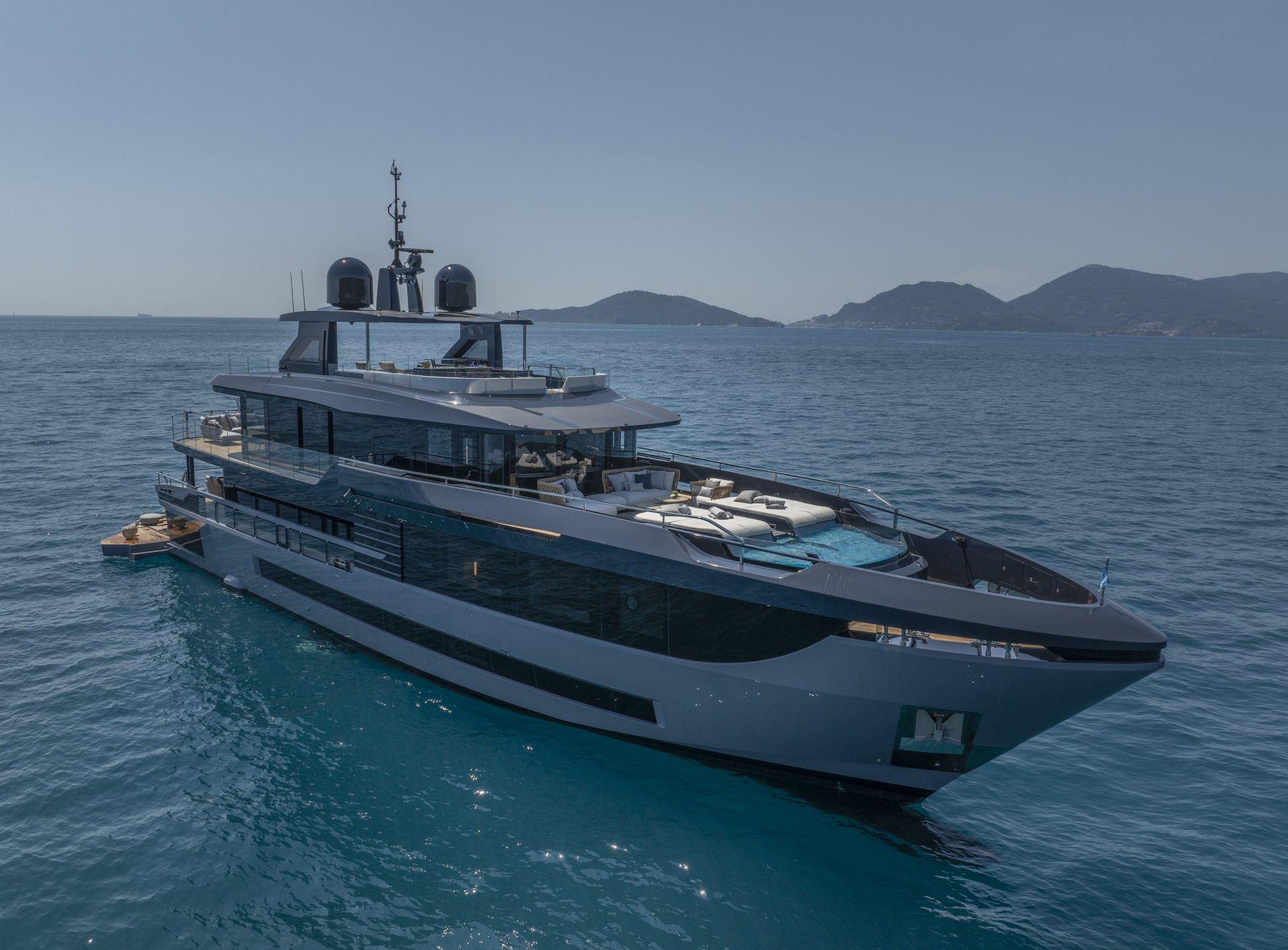 Mangusta yacht cruising in clear blue waters