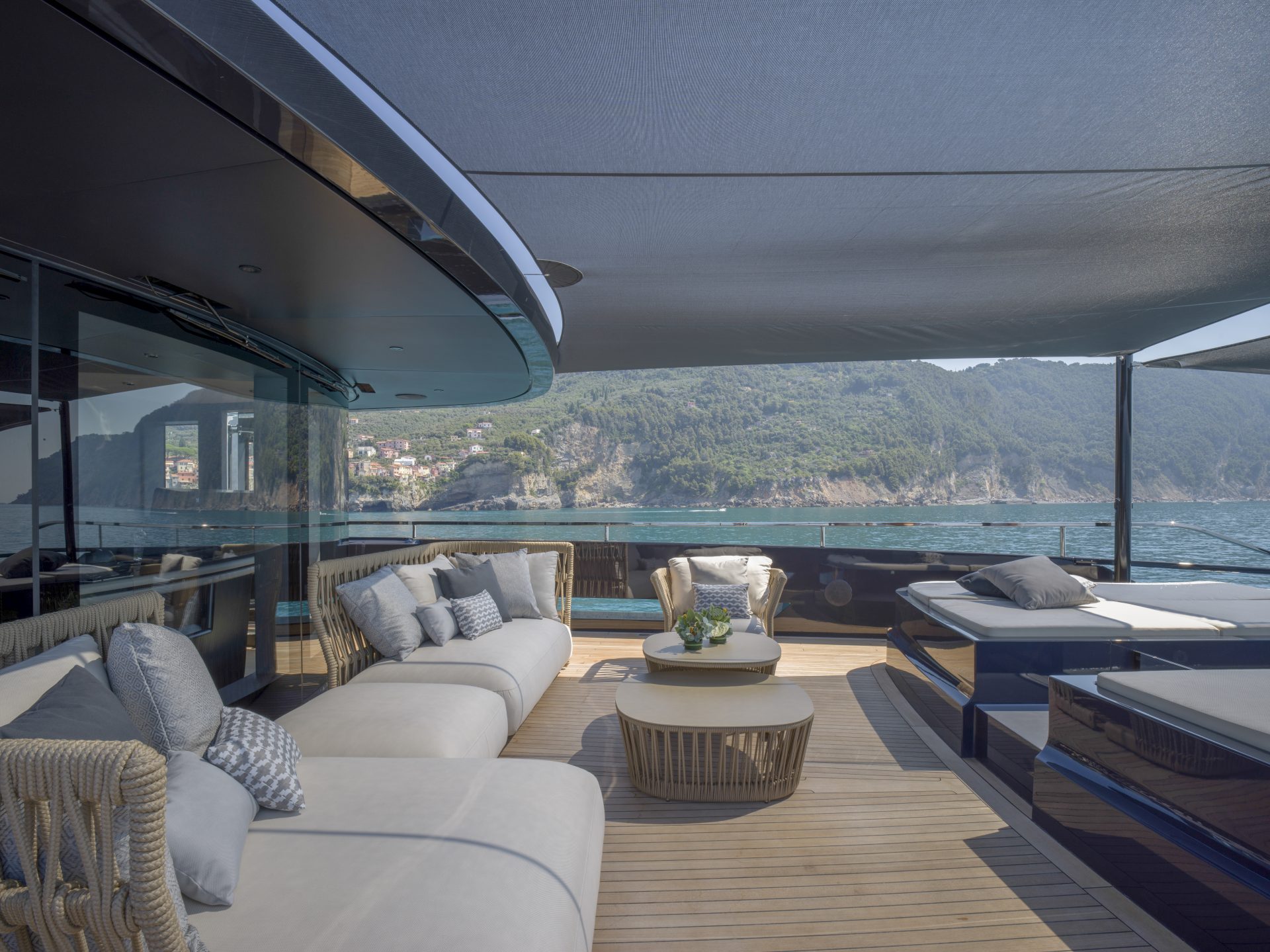 Luxury yacht deck with sofas and sea view