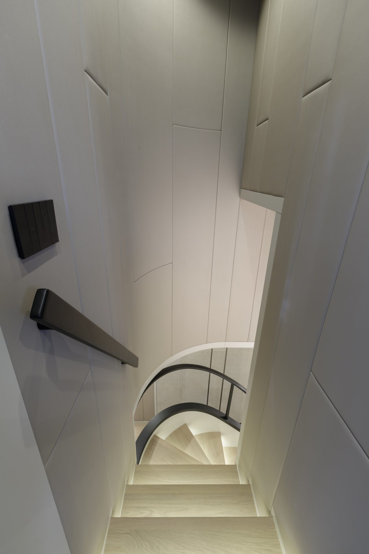 Curved staircase inside luxury Mangusta yacht