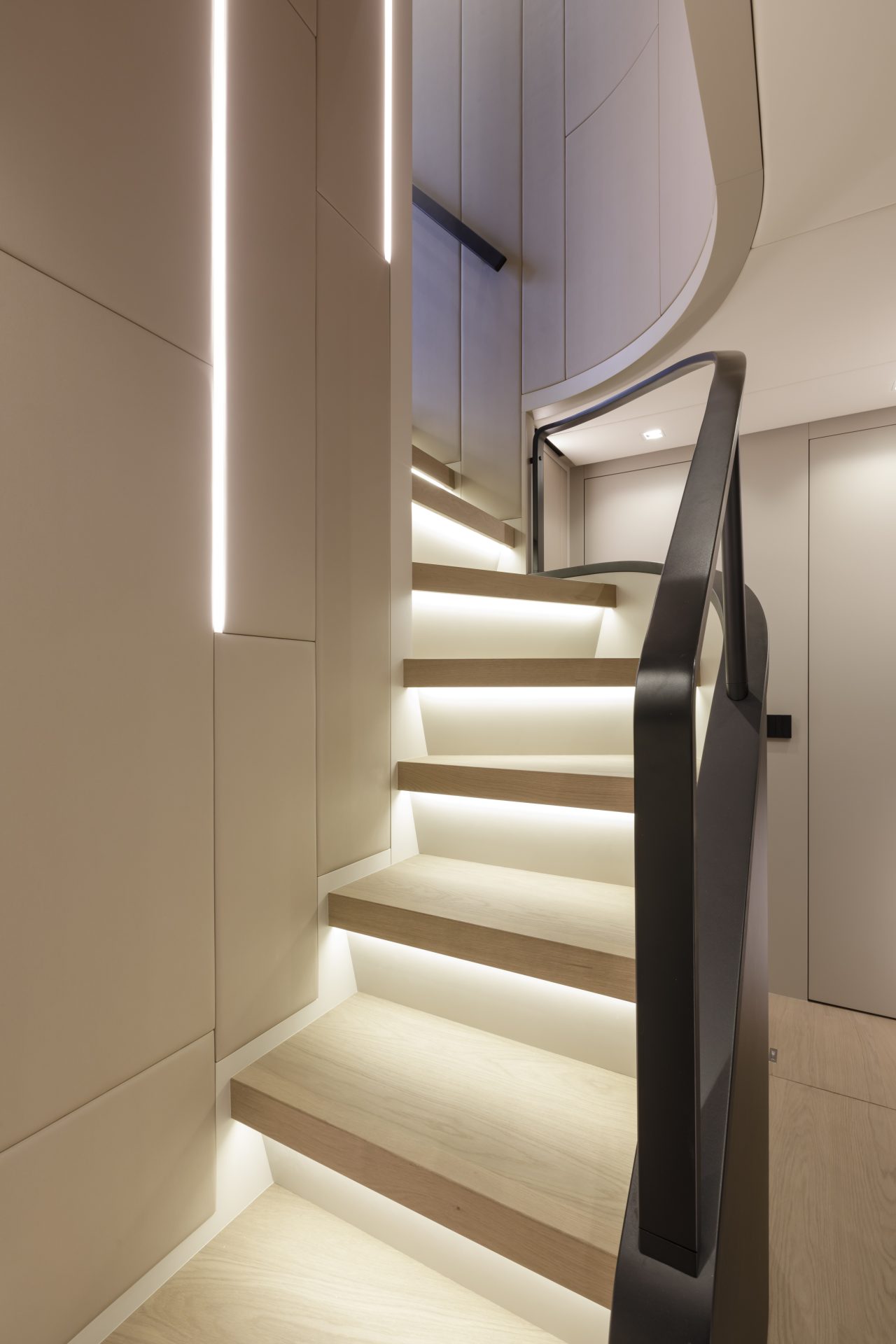 Modern staircase with soft LED lighting on yacht