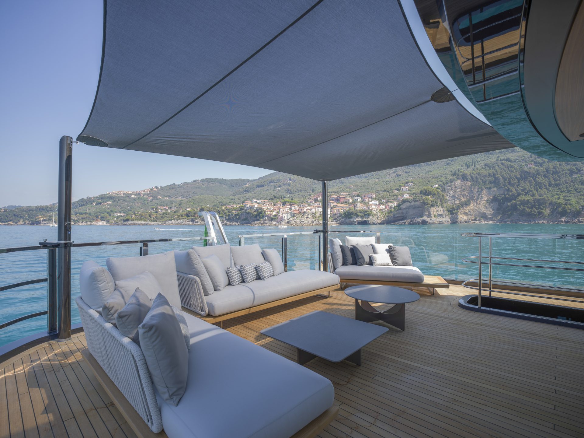 Luxurious yacht deck with sea view and sofas