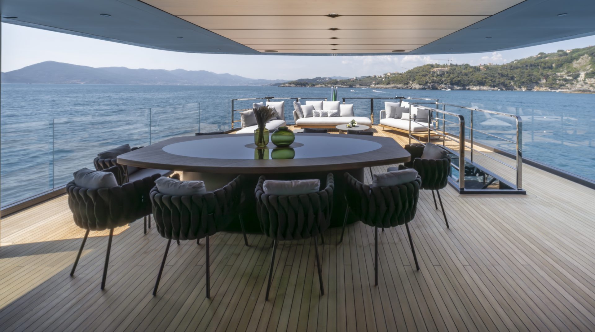 Spacious deck with seating on Mangusta Yacht.