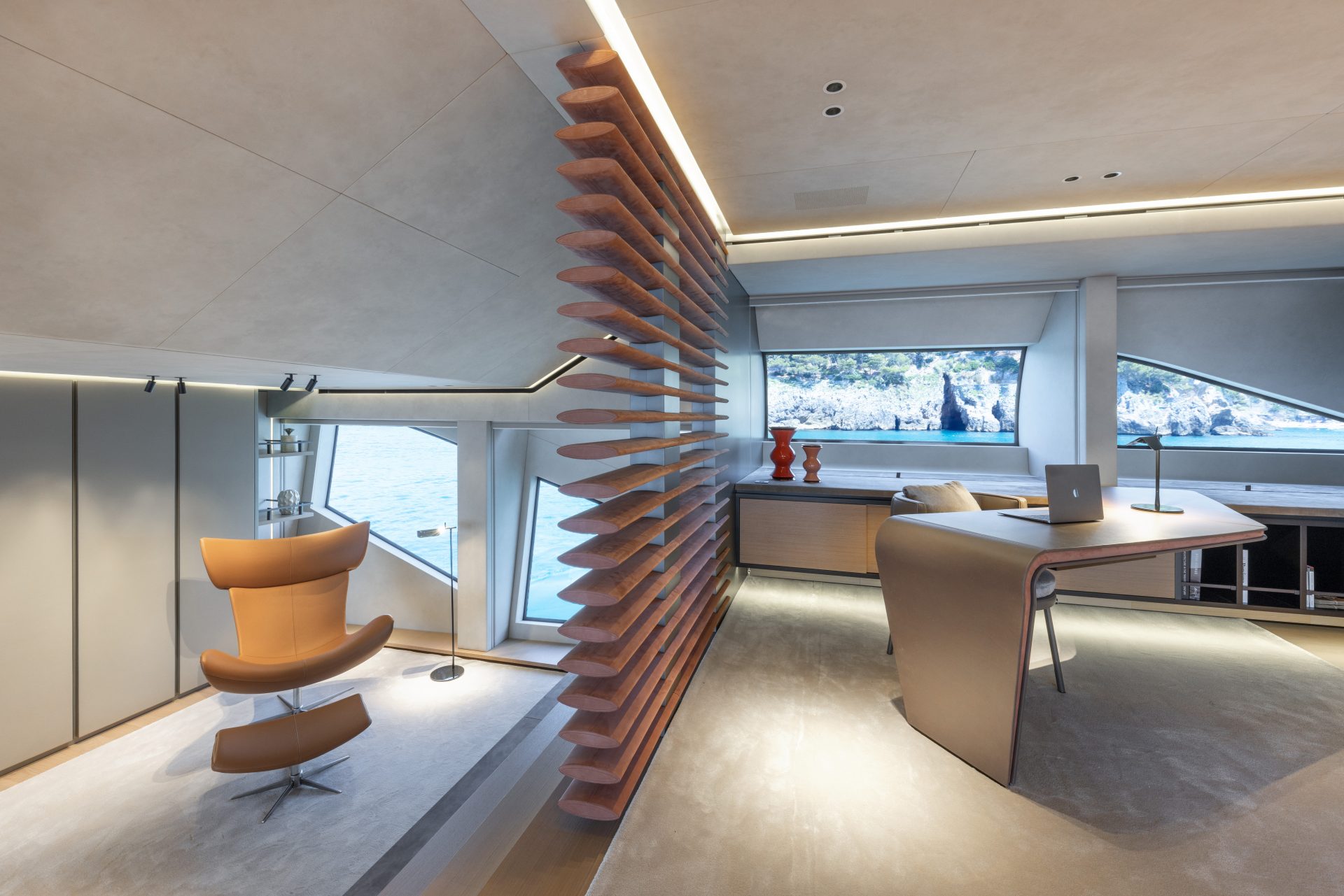 Modern yacht interior with stylish furniture and sea view.