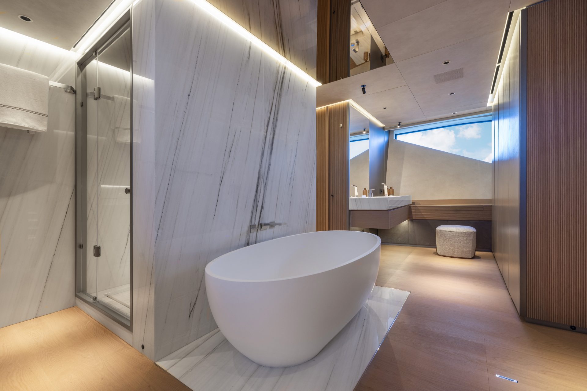 Luxurious yacht bathroom with a freestanding tub.