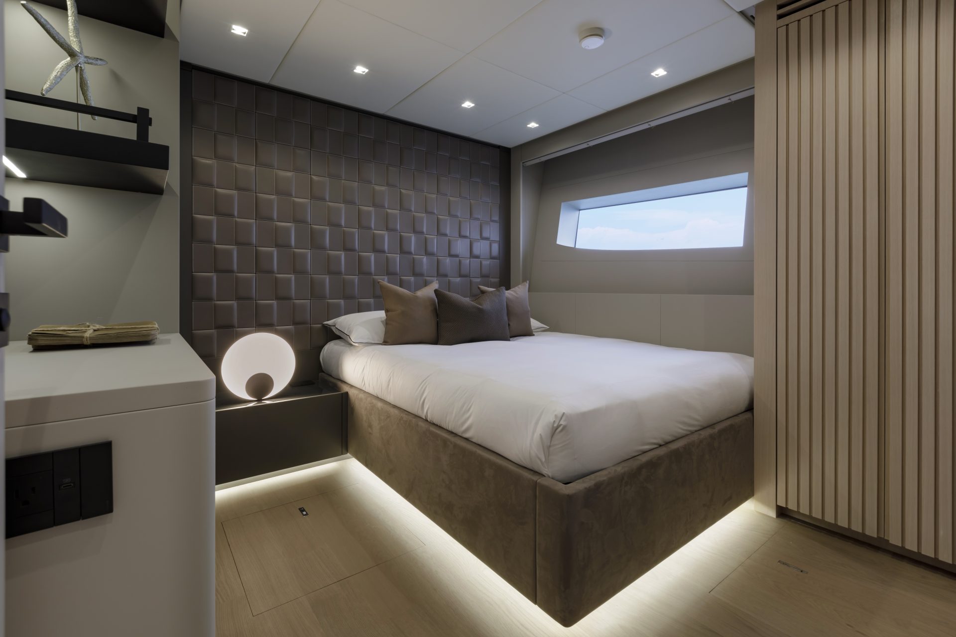 Luxury yacht bedroom with modern design.