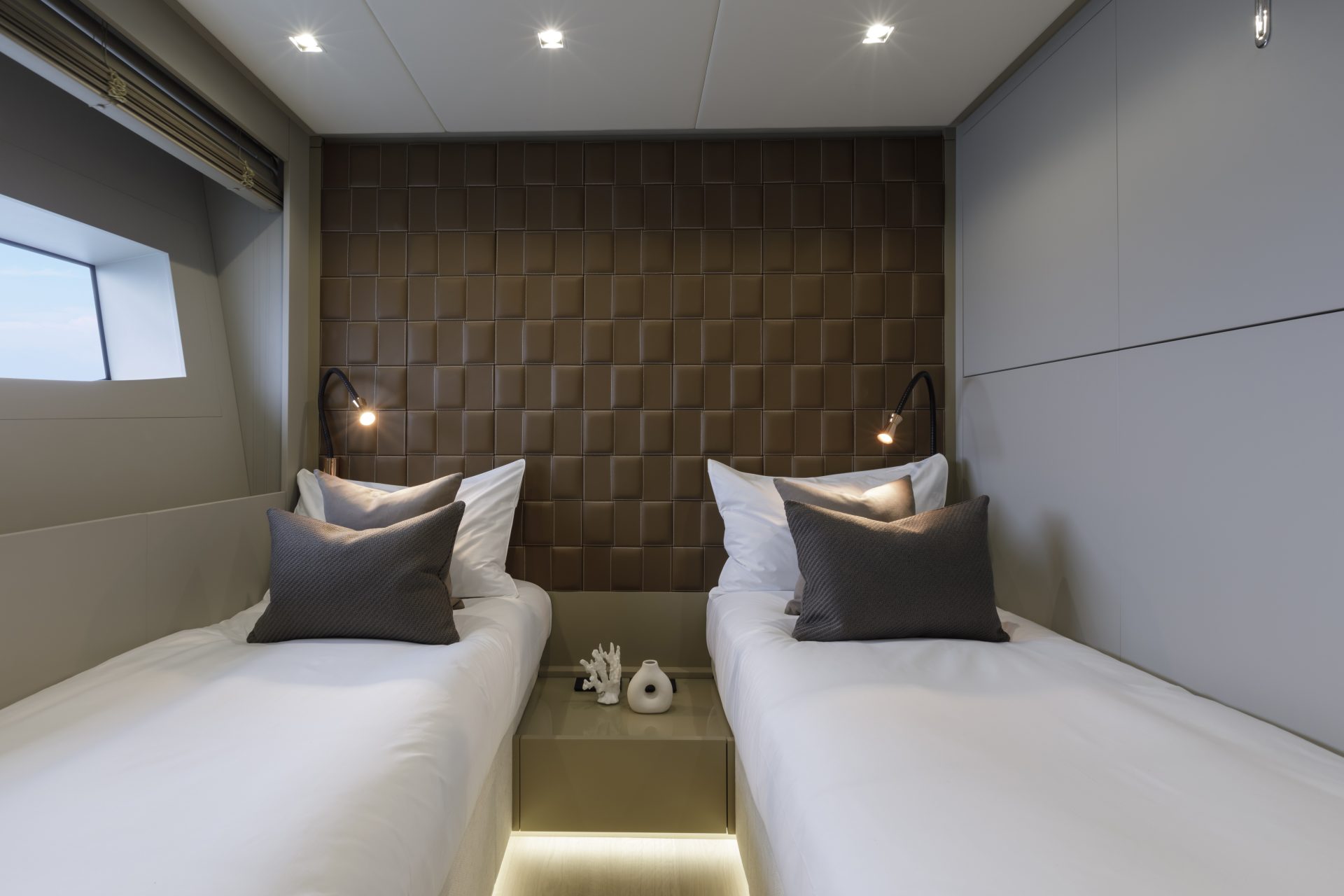 Luxury twin cabin on a Mangusta Yacht interior.
