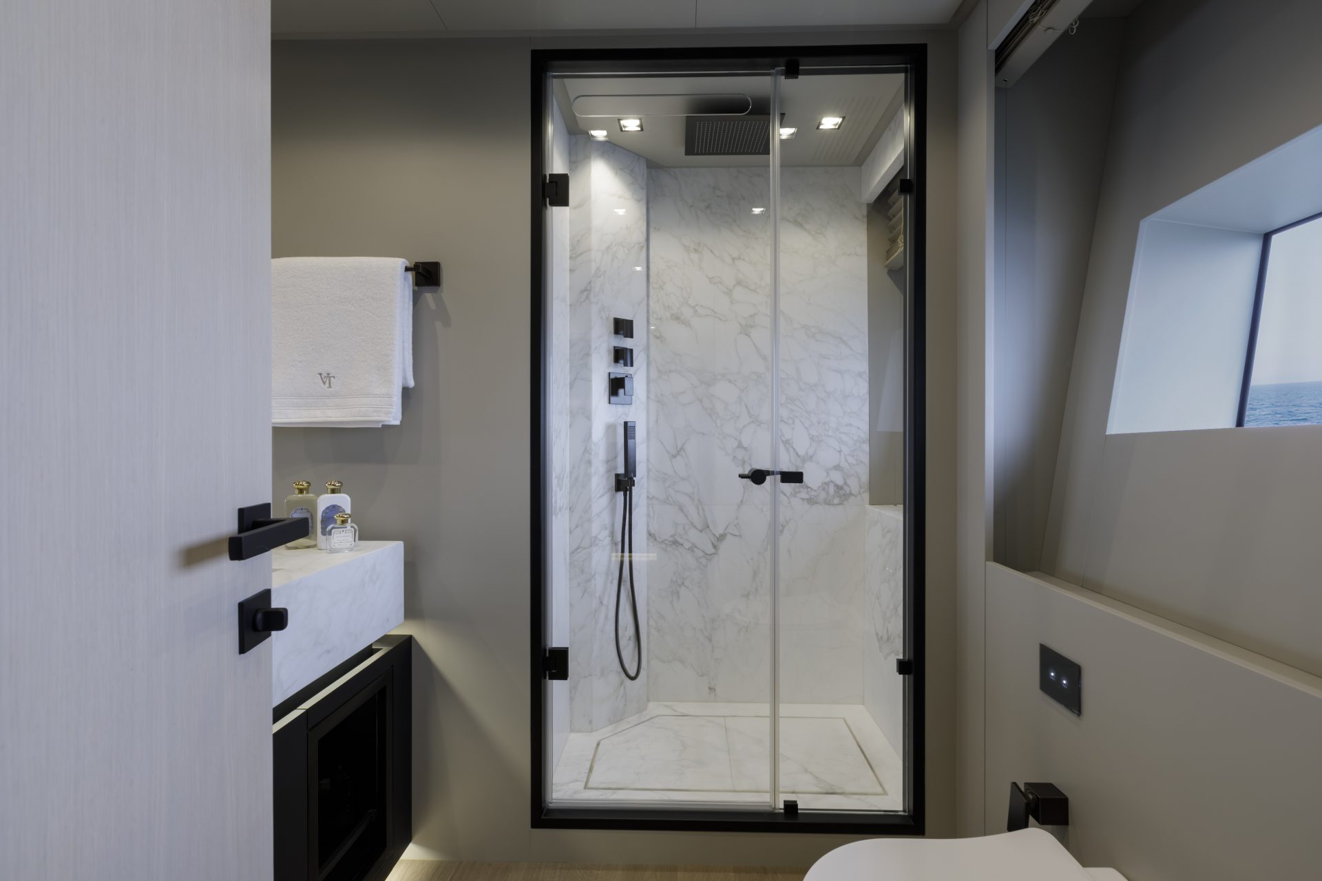 Luxurious yacht bathroom with marble shower.