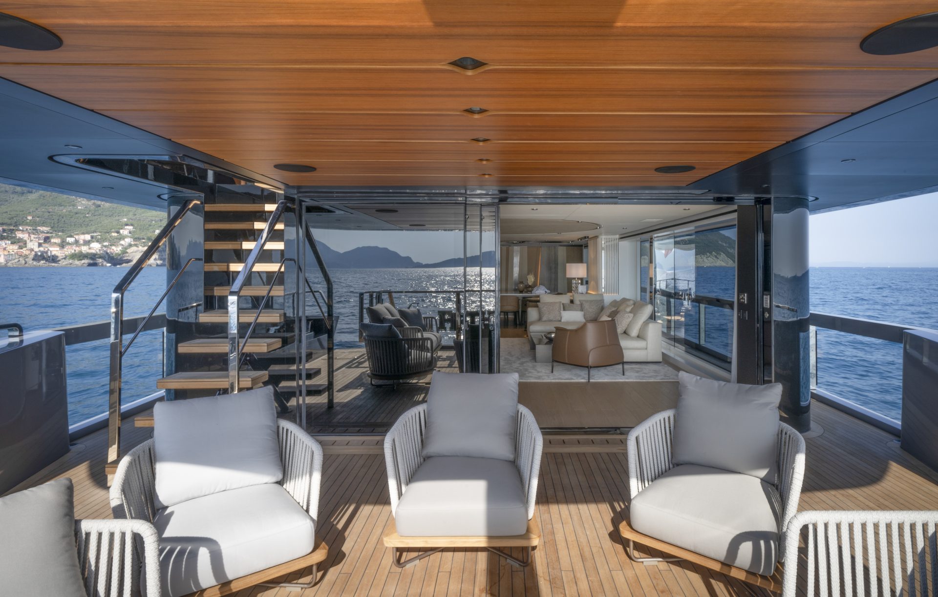 Luxury yacht deck with elegant seating and sea view.