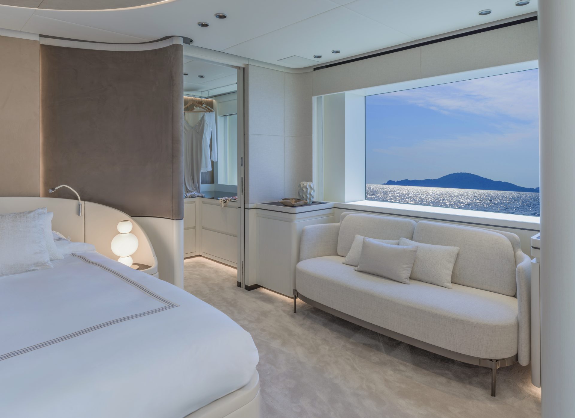 Luxury yacht bedroom with sea view window.