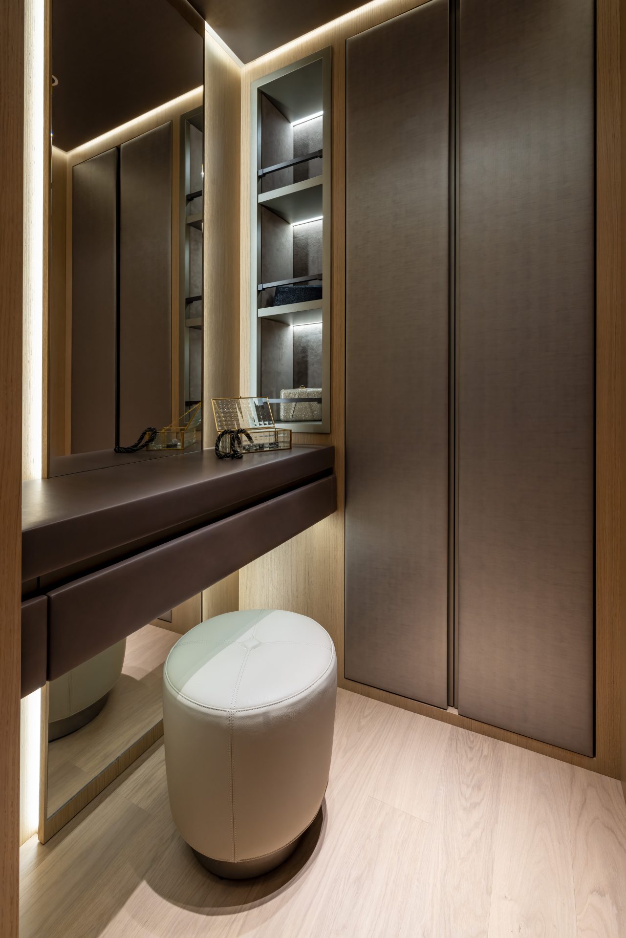Luxury yacht interior with dressing table and stool.