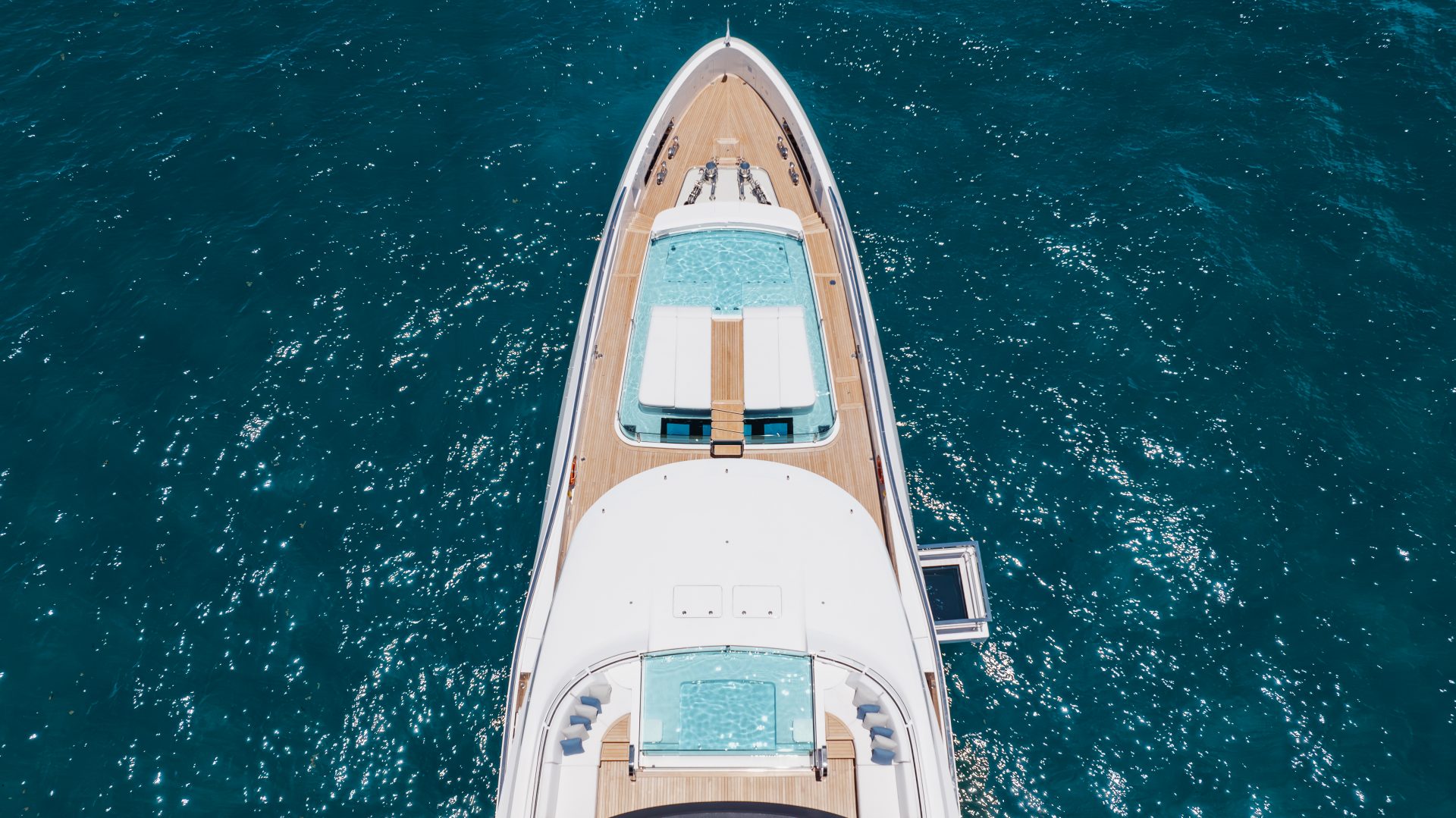 Mangusta yacht aerial view, luxury deck and water.