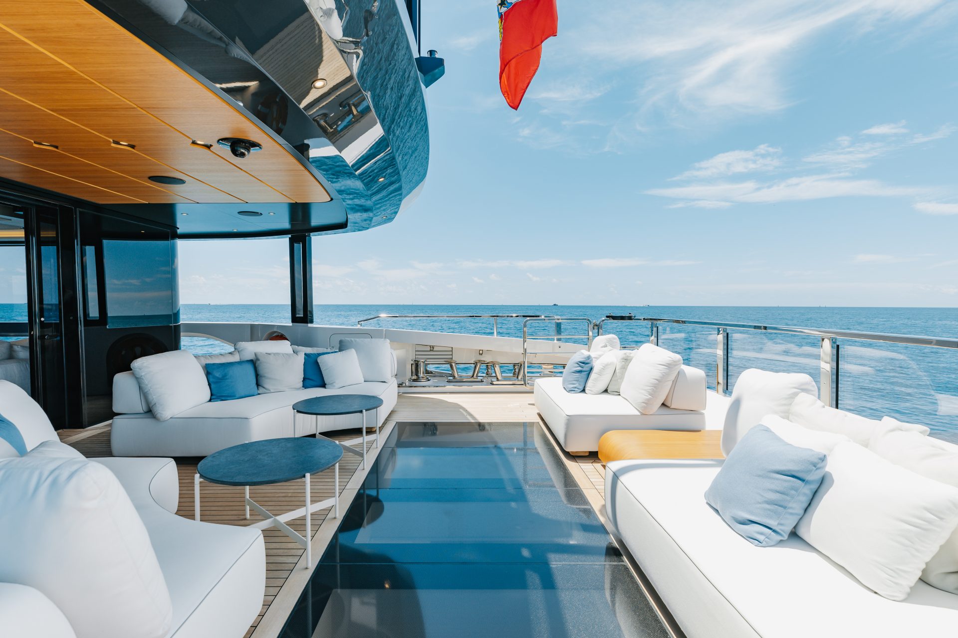Luxury yacht deck with ocean view and plush seating