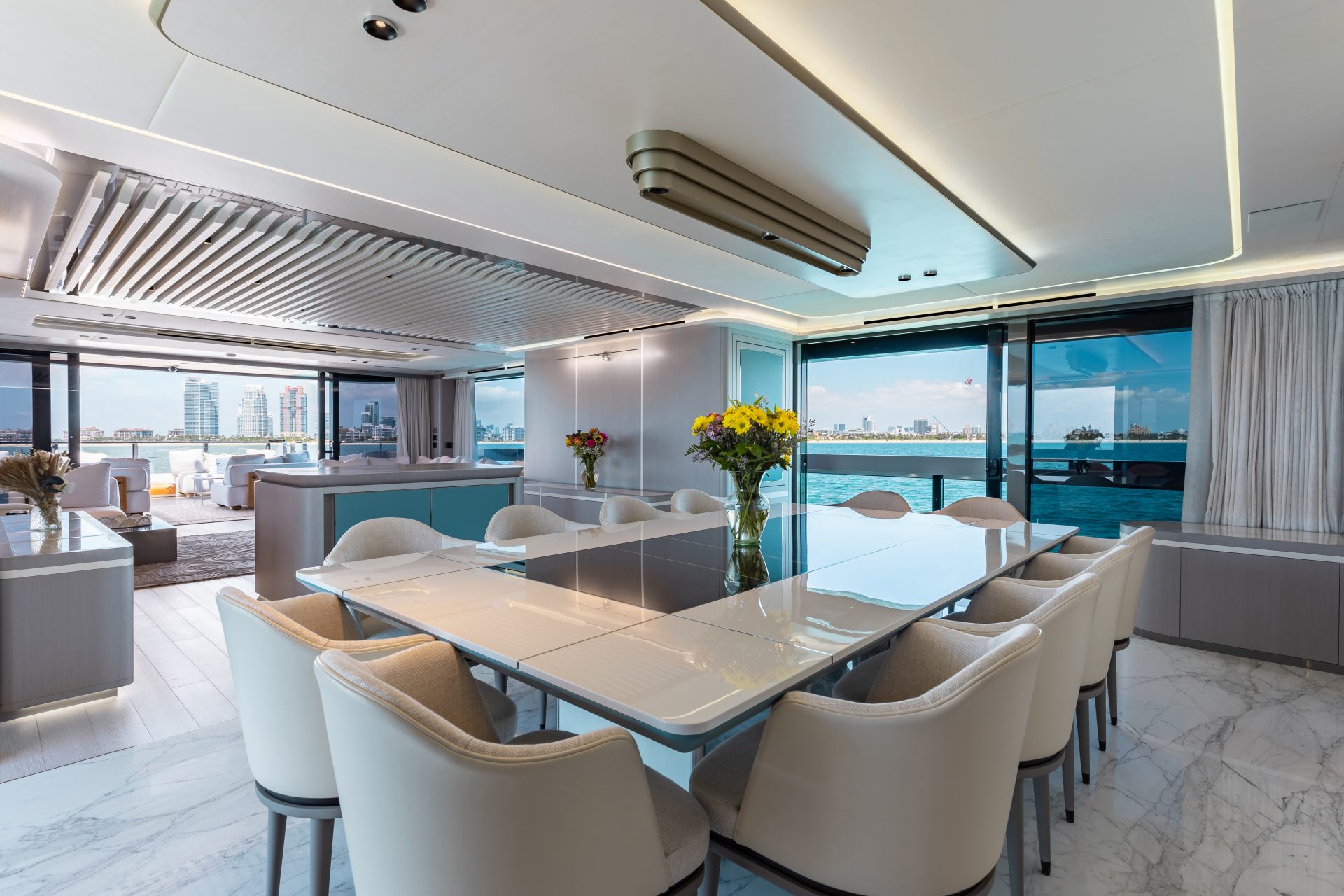 Luxurious yacht dining room with ocean view.