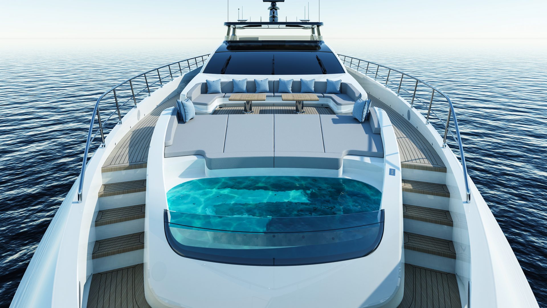 Luxury yacht deck with pool and seating area.
